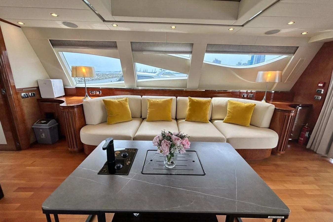 a living room with a white couch aboard SUNSHINE Yacht for Sale