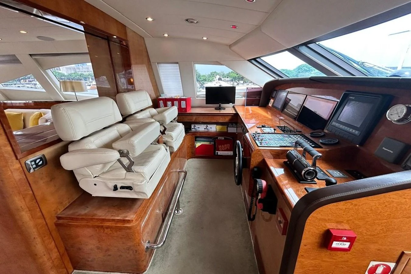 a room with a couch and a desk with computers on it aboard SUNSHINE Yacht for Sale