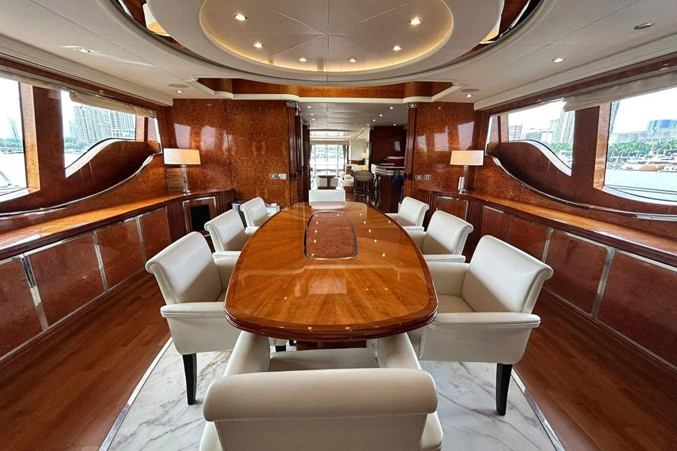 a large room with a table and chairs aboard SUNSHINE Yacht for Sale
