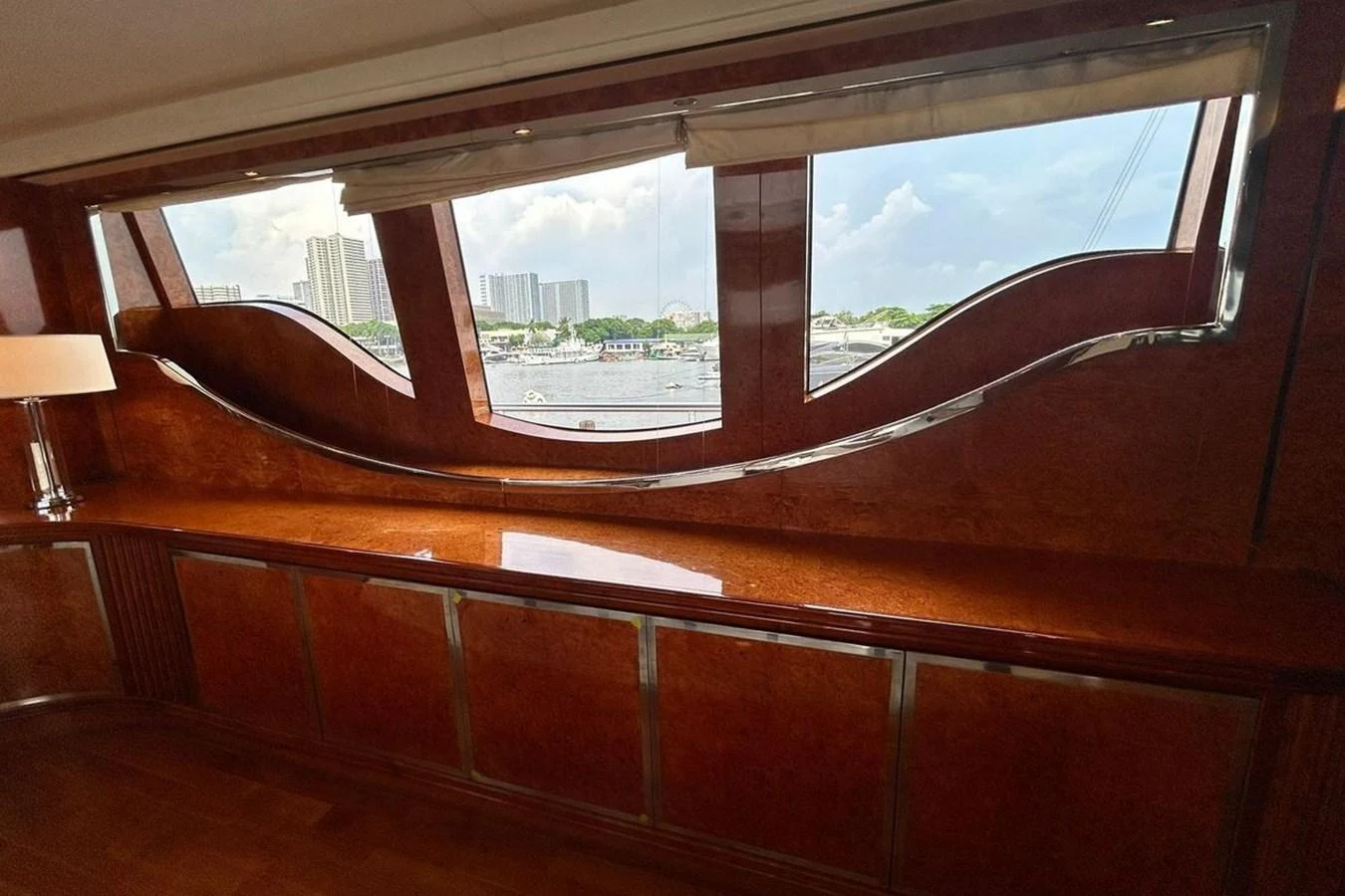 a window with a view of a city aboard SUNSHINE Yacht for Sale
