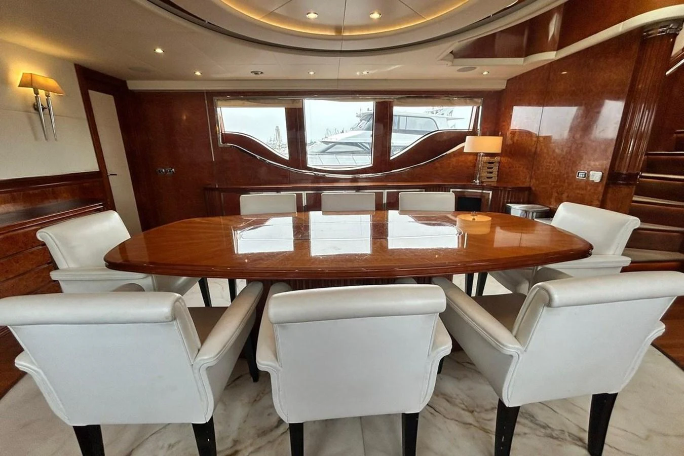 a wooden table with chairs around it aboard SUNSHINE Yacht for Sale