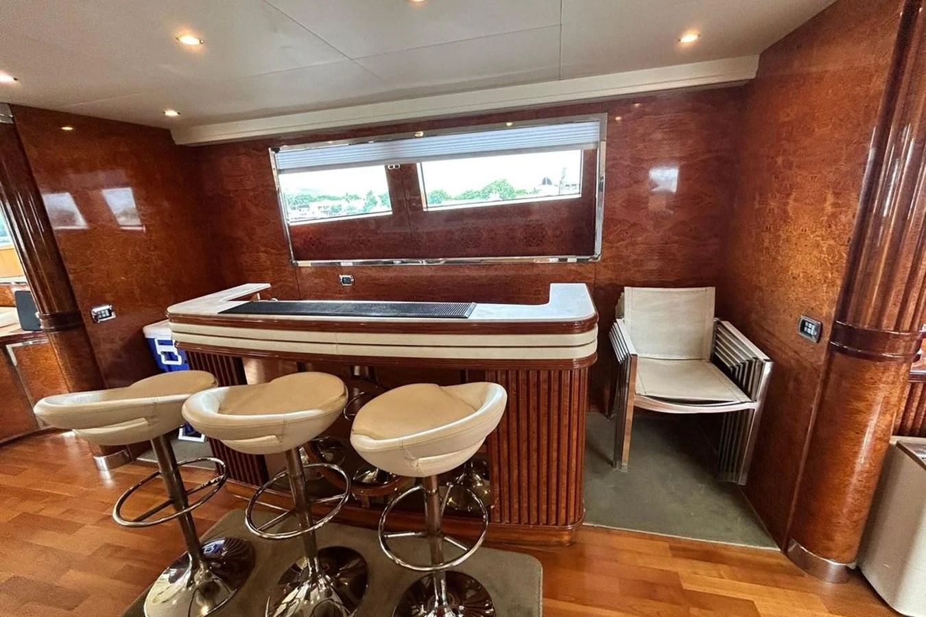 a room with a piano and chairs aboard SUNSHINE Yacht for Sale