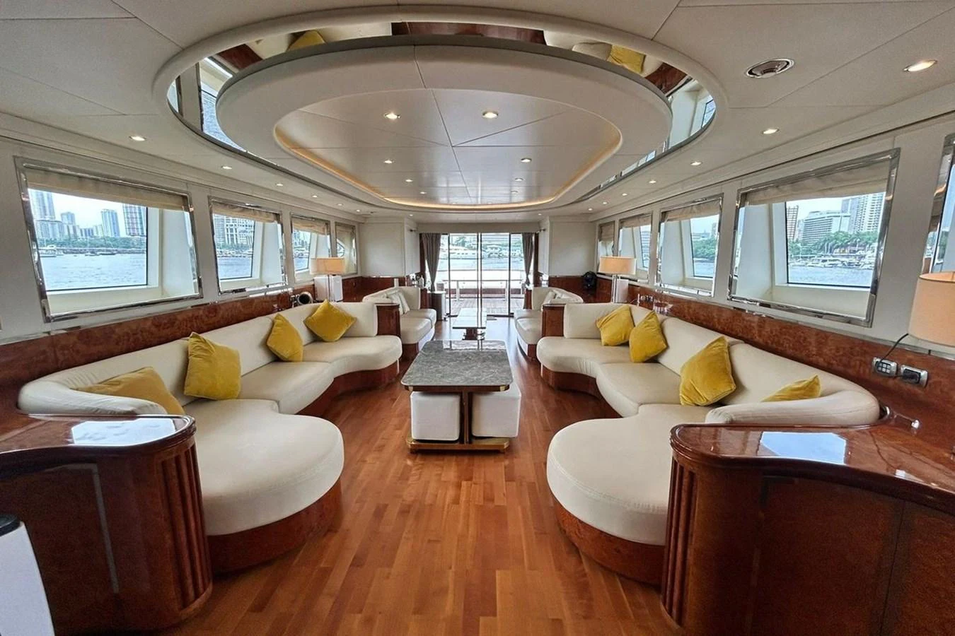a living room with a large chandelier aboard SUNSHINE Yacht for Sale