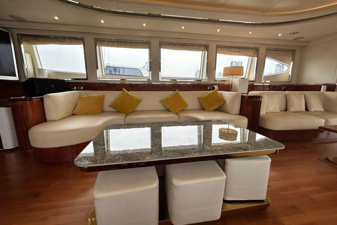 a living room with a couch and a table aboard SUNSHINE Yacht for Sale