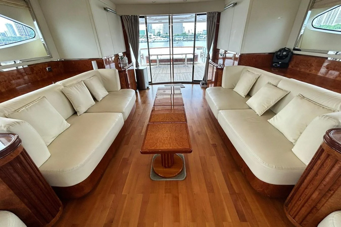 a living room with a wood floor aboard SUNSHINE Yacht for Sale