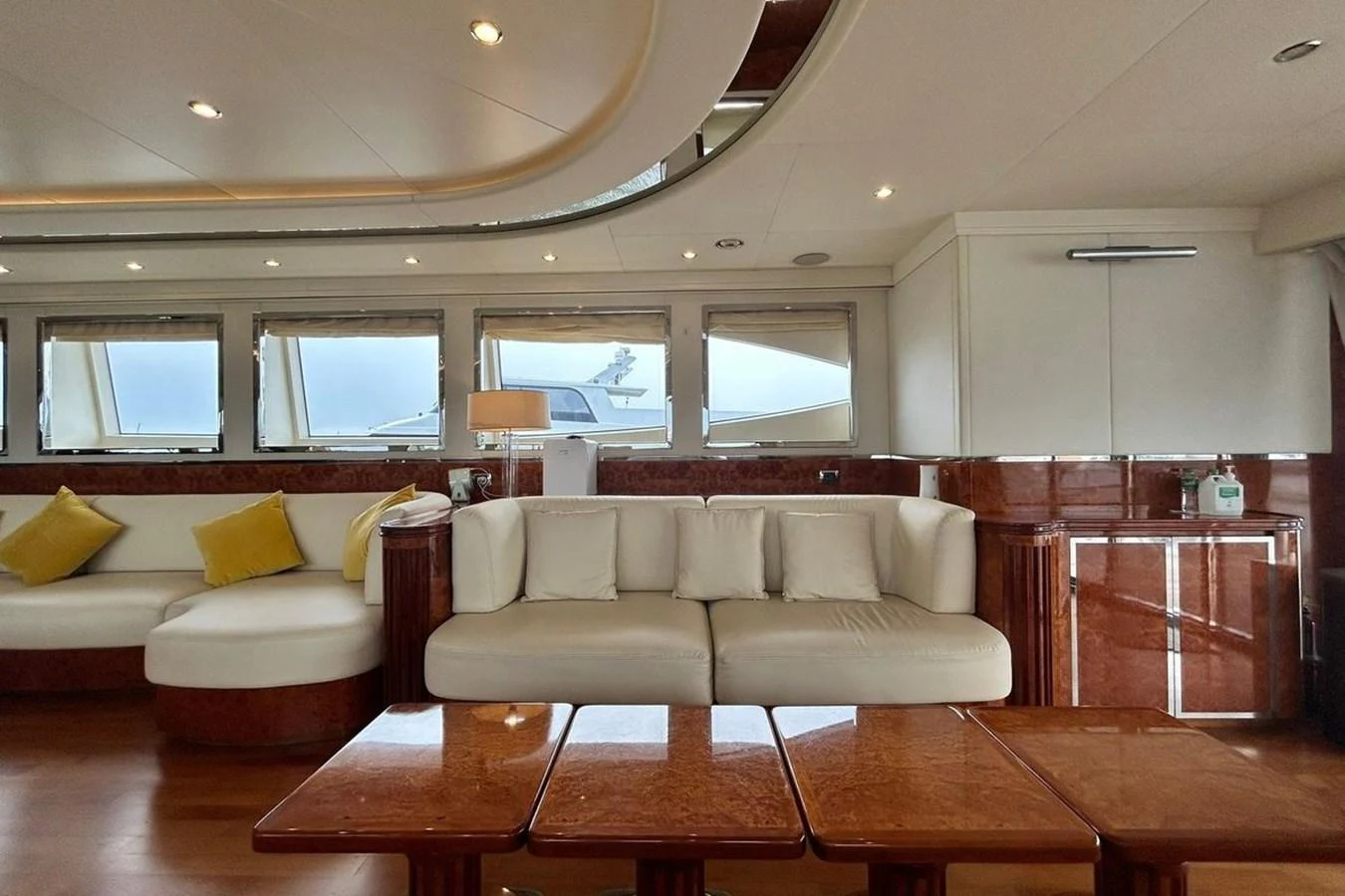 a living room with a couch and a table aboard SUNSHINE Yacht for Sale
