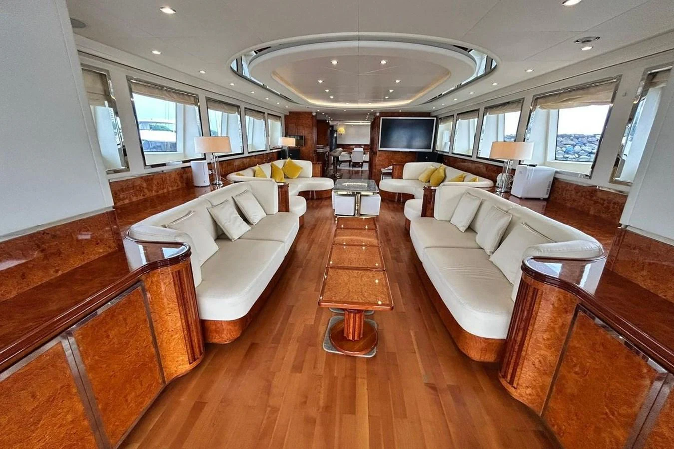 a living room with a large chandelier aboard SUNSHINE Yacht for Sale