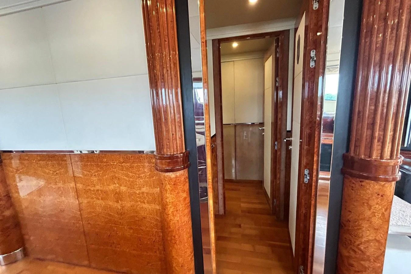 a hallway with doors aboard SUNSHINE Yacht for Sale