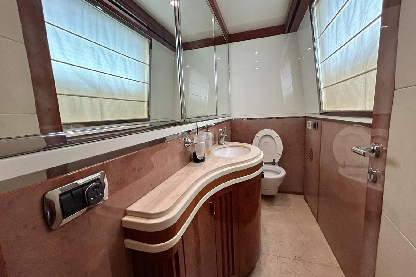 a bathroom with a toilet and a bathtub aboard SUNSHINE Yacht for Sale