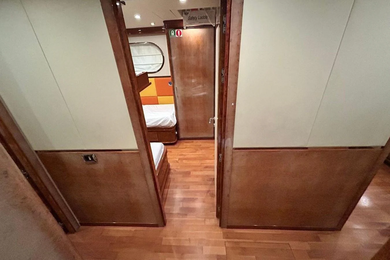a hallway with a wood floor aboard SUNSHINE Yacht for Sale