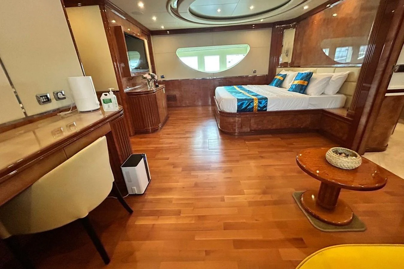 a room with a bed and a couch aboard SUNSHINE Yacht for Sale