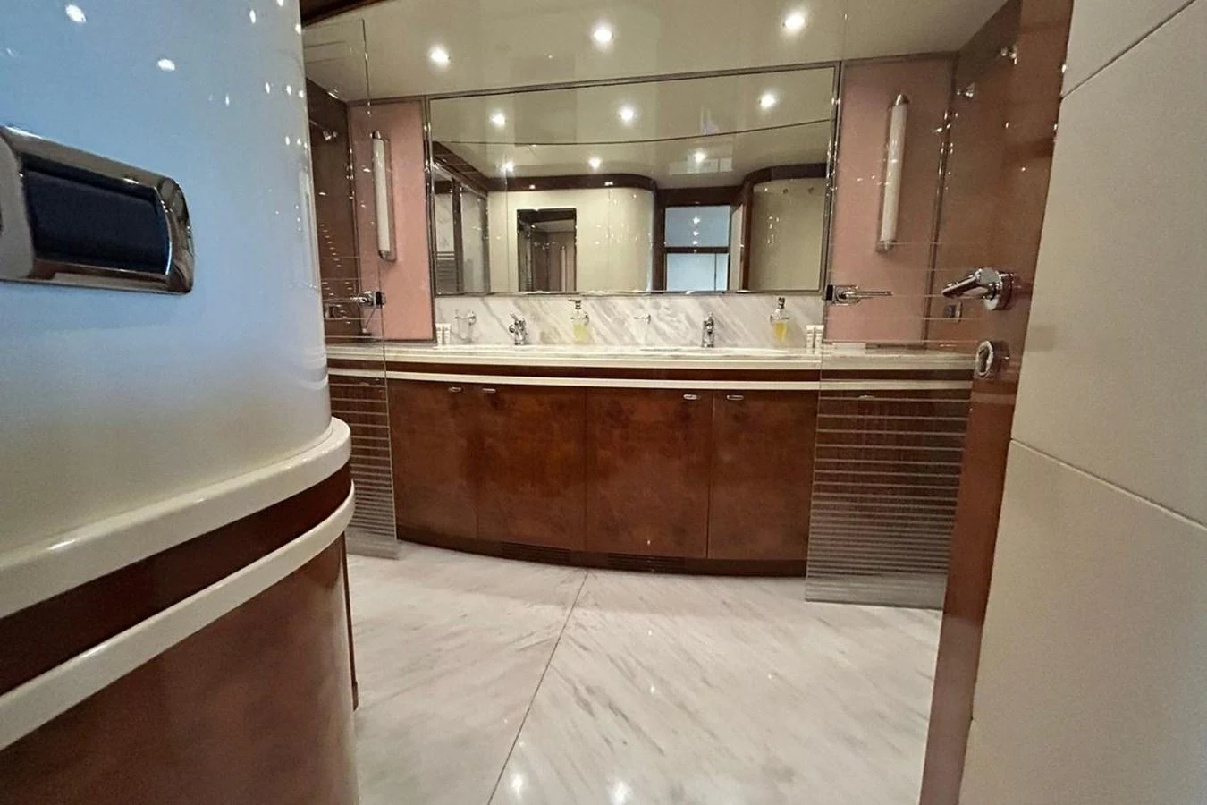 a bathroom with a large mirror aboard SUNSHINE Yacht for Sale