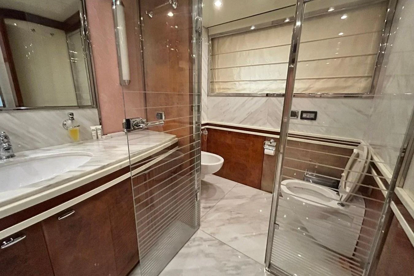 a bathroom with a glass shower aboard SUNSHINE Yacht for Sale