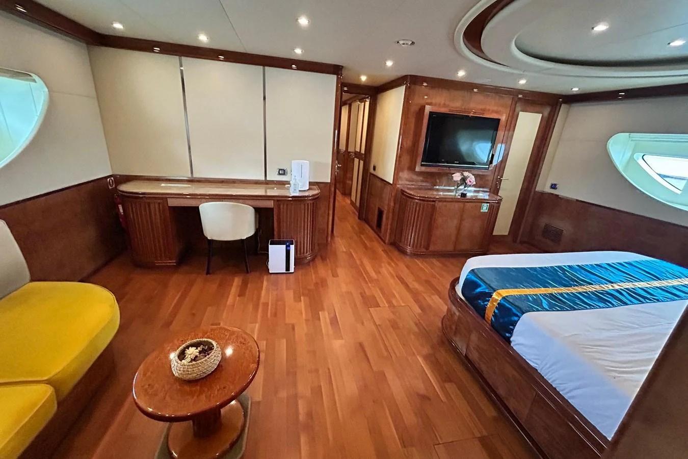 a room with a bed and a television aboard SUNSHINE Yacht for Sale