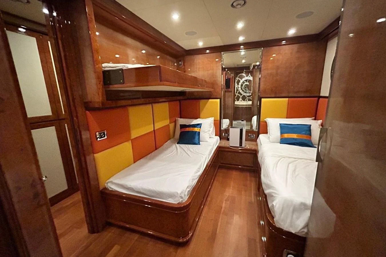 a room with a bed and a mirror aboard SUNSHINE Yacht for Sale