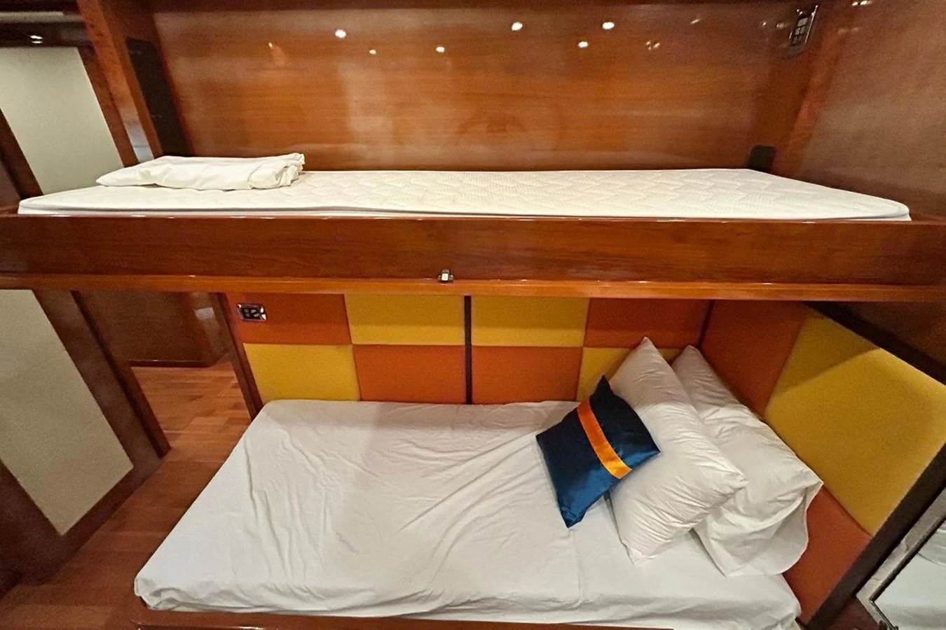 a bed with white sheets aboard SUNSHINE Yacht for Sale