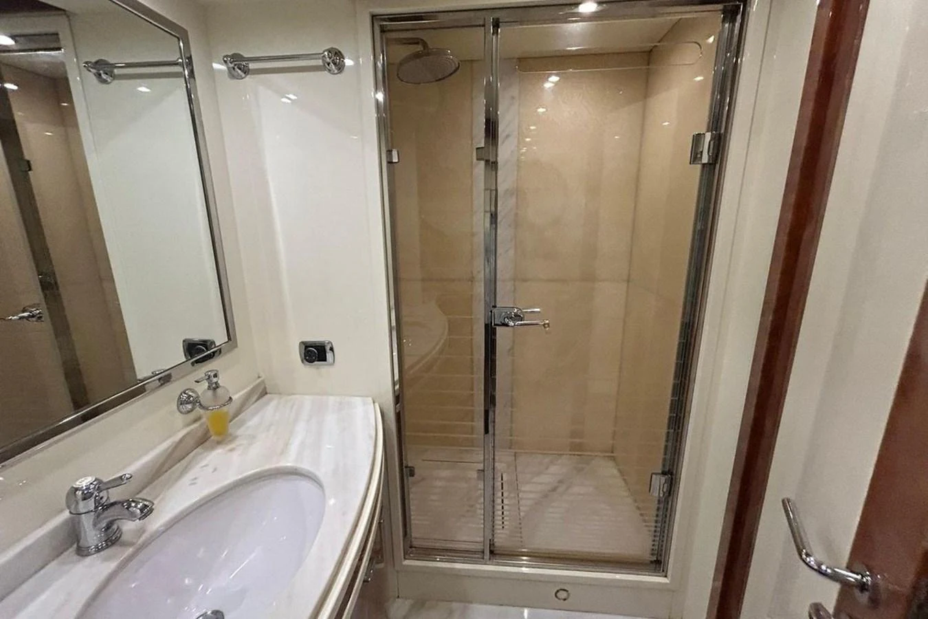 a bathroom with a glass shower aboard SUNSHINE Yacht for Sale