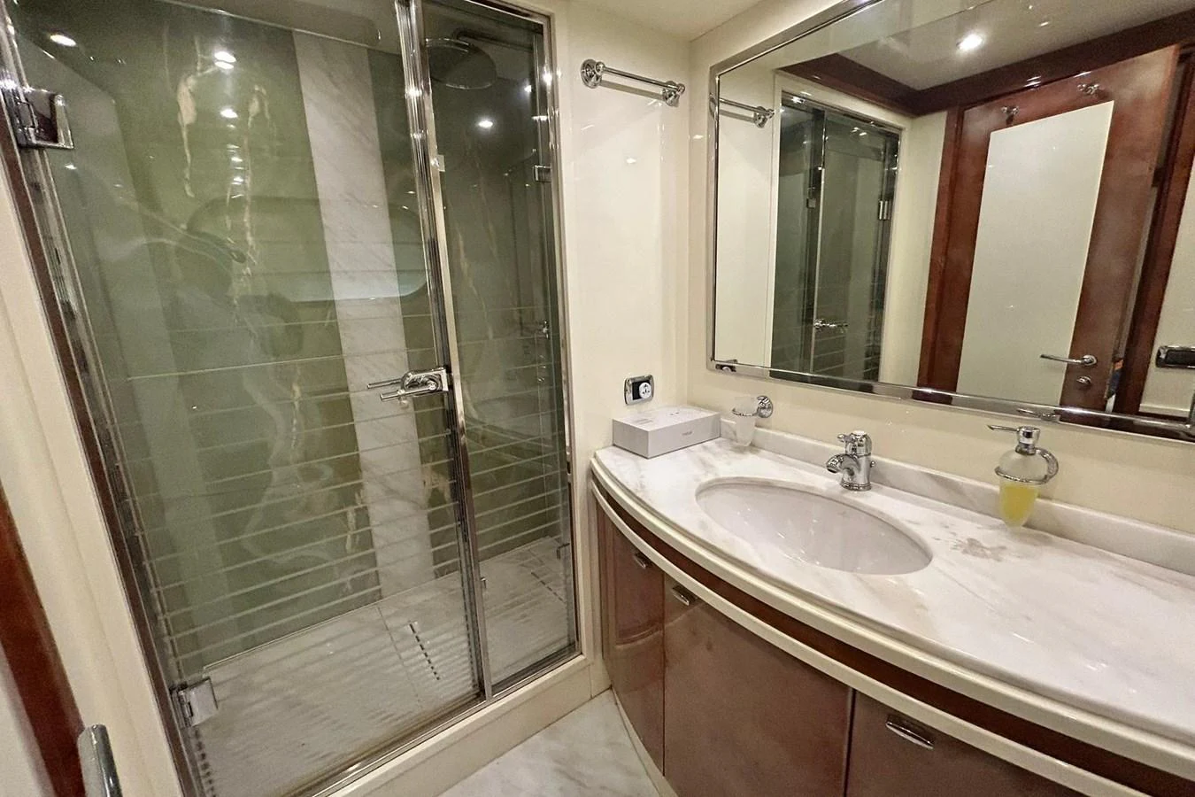 a bathroom with a glass shower aboard SUNSHINE Yacht for Sale