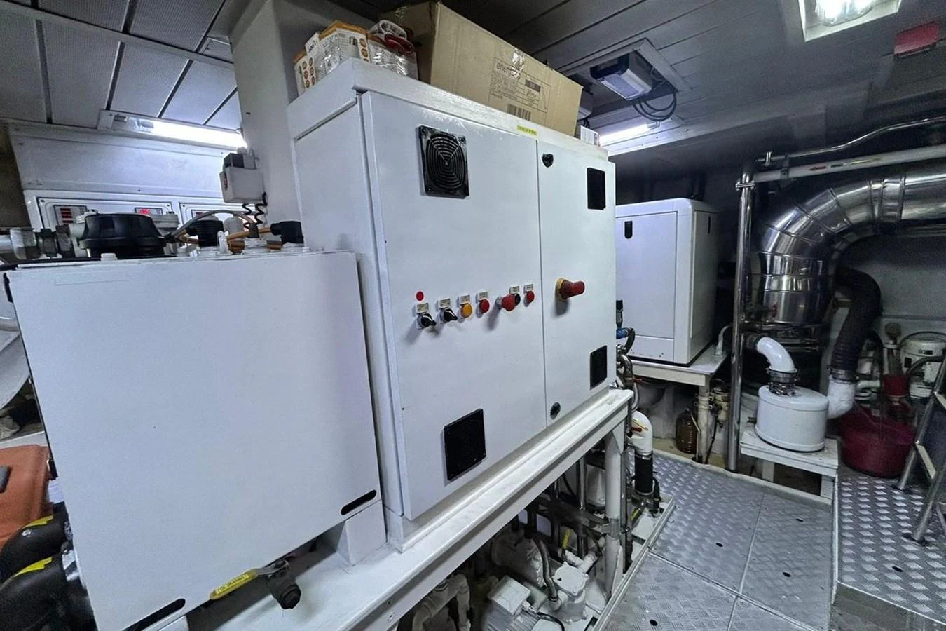 a large white machine in a room aboard SUNSHINE Yacht for Sale
