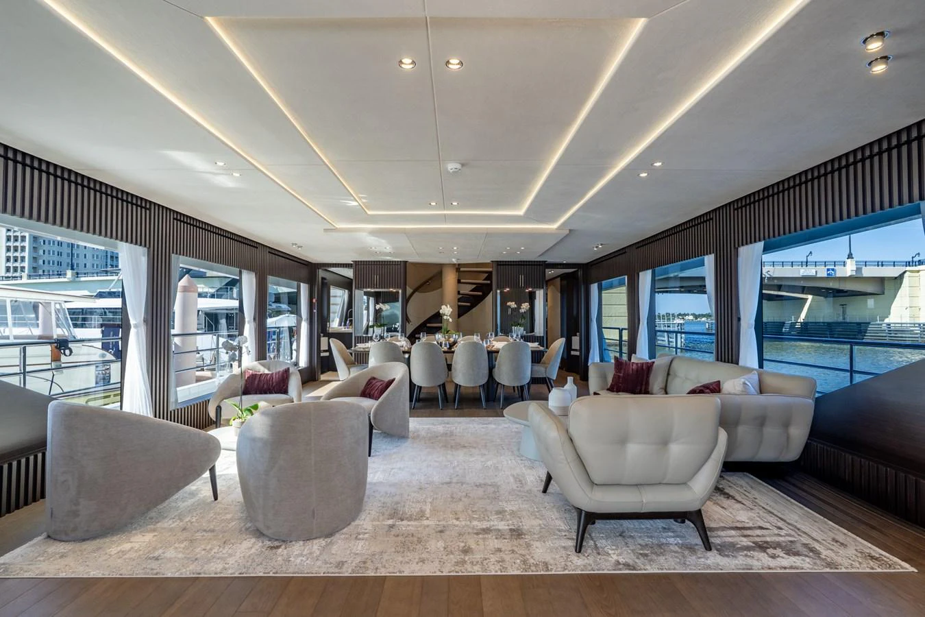 a living room with a large window aboard RESONANCE Yacht for Sale