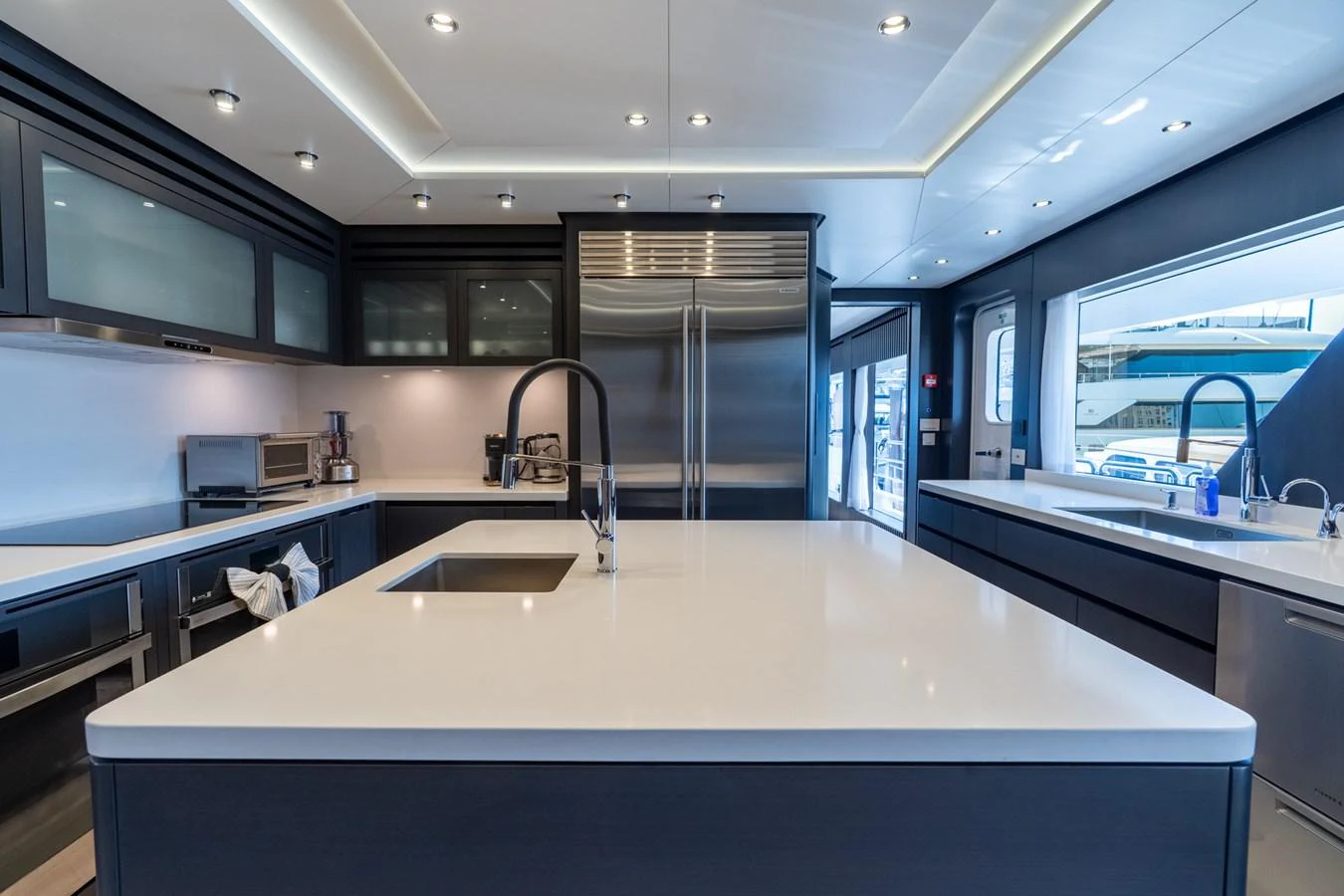 a kitchen with a large island aboard RESONANCE Yacht for Sale