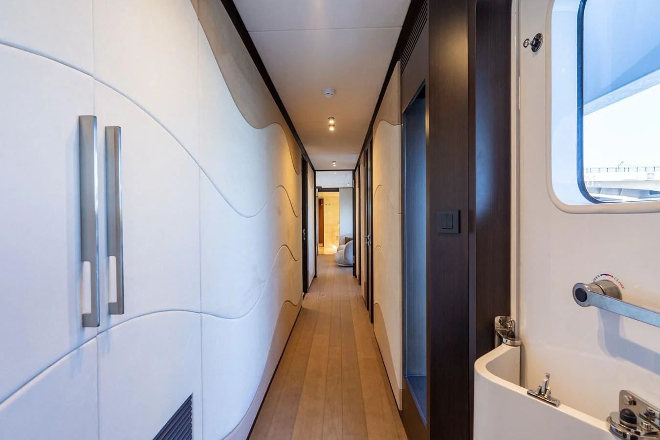 a bathroom with a tub sink and a toilet aboard RESONANCE Yacht for Sale