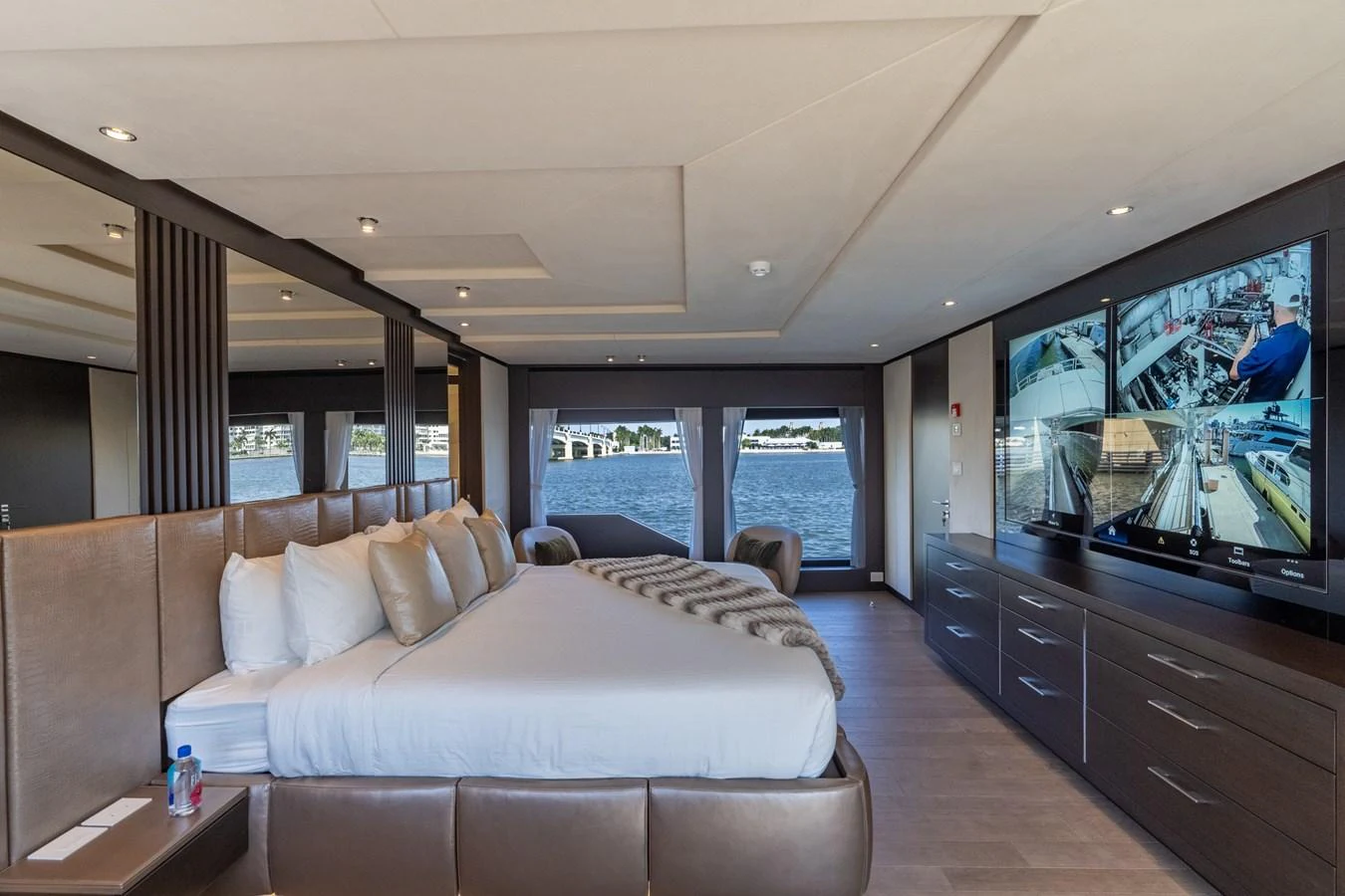 a living room with a large screen aboard RESONANCE Yacht for Sale