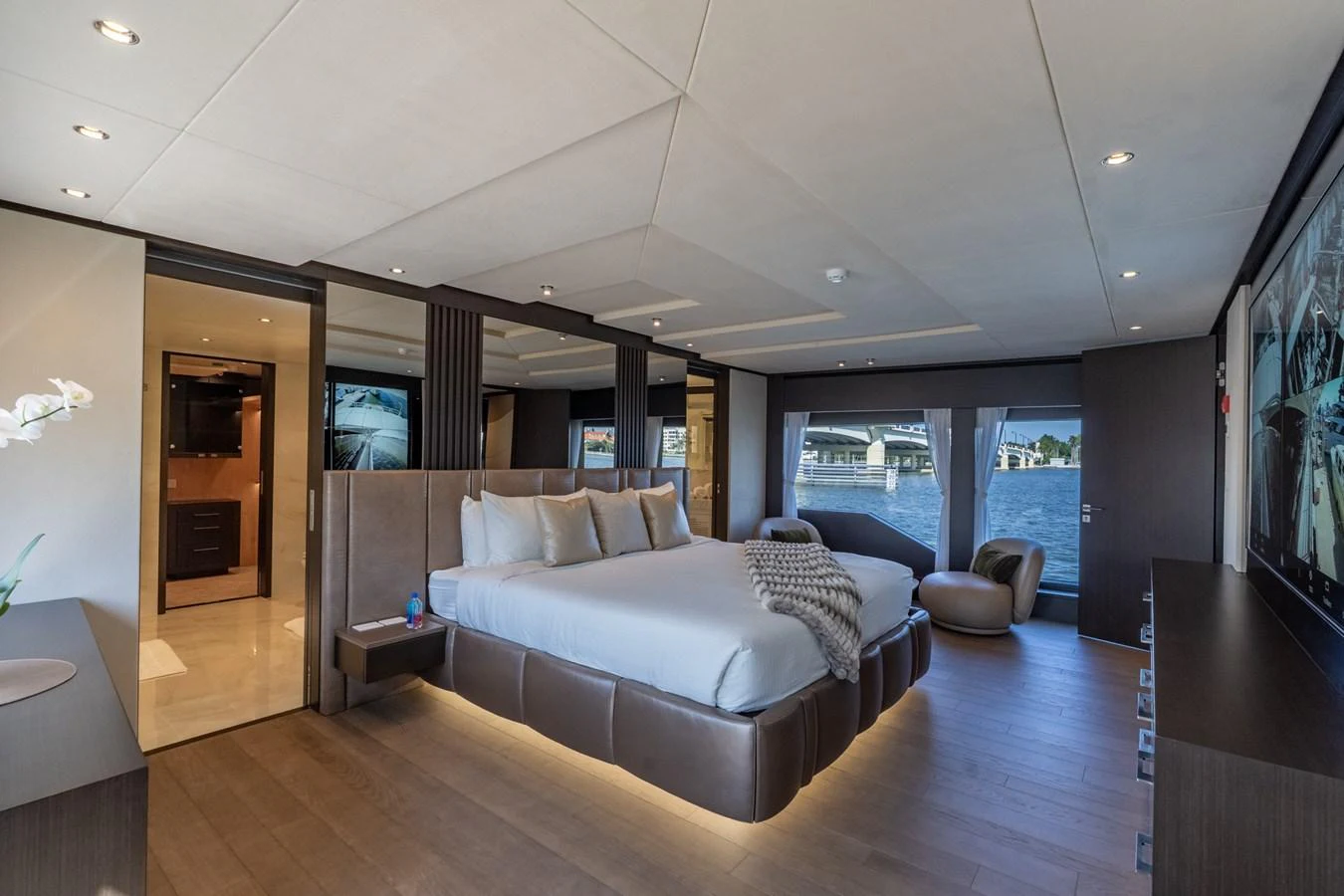 a living room with a large window aboard RESONANCE Yacht for Sale
