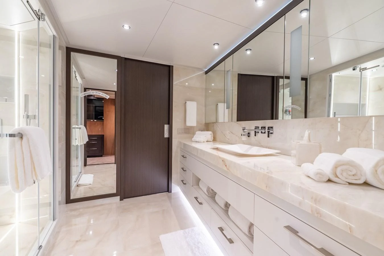 a bathroom with a large mirror aboard RESONANCE Yacht for Sale