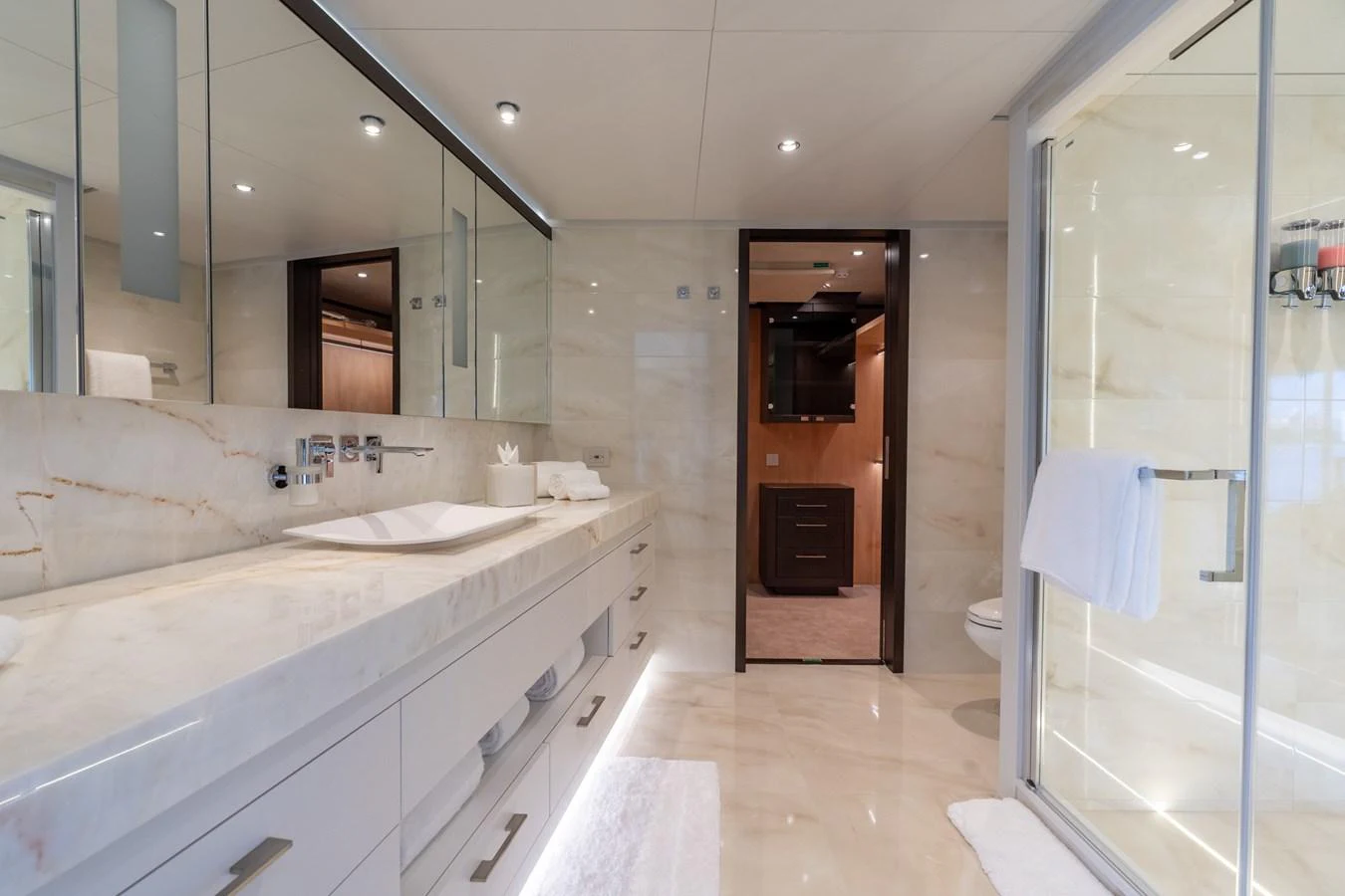 a bathroom with a large mirror aboard RESONANCE Yacht for Sale