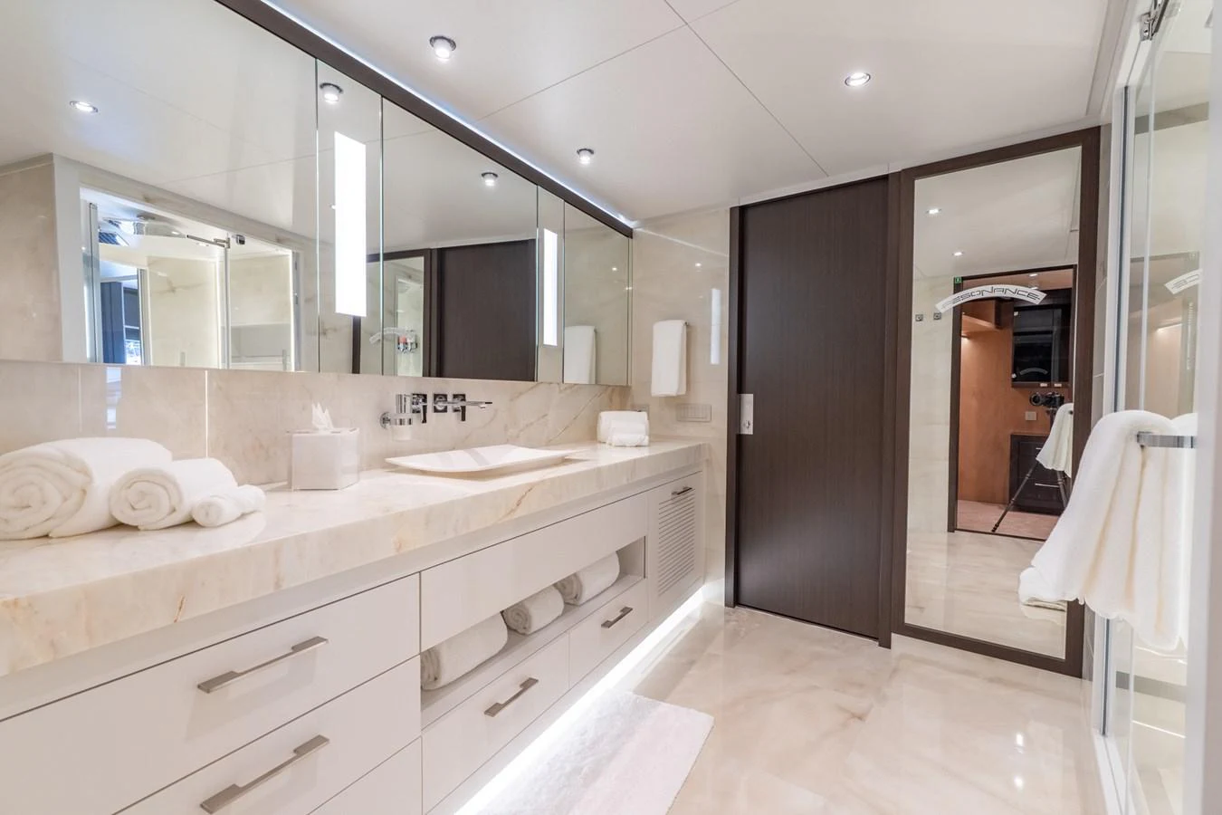 a bathroom with a large mirror aboard RESONANCE Yacht for Sale