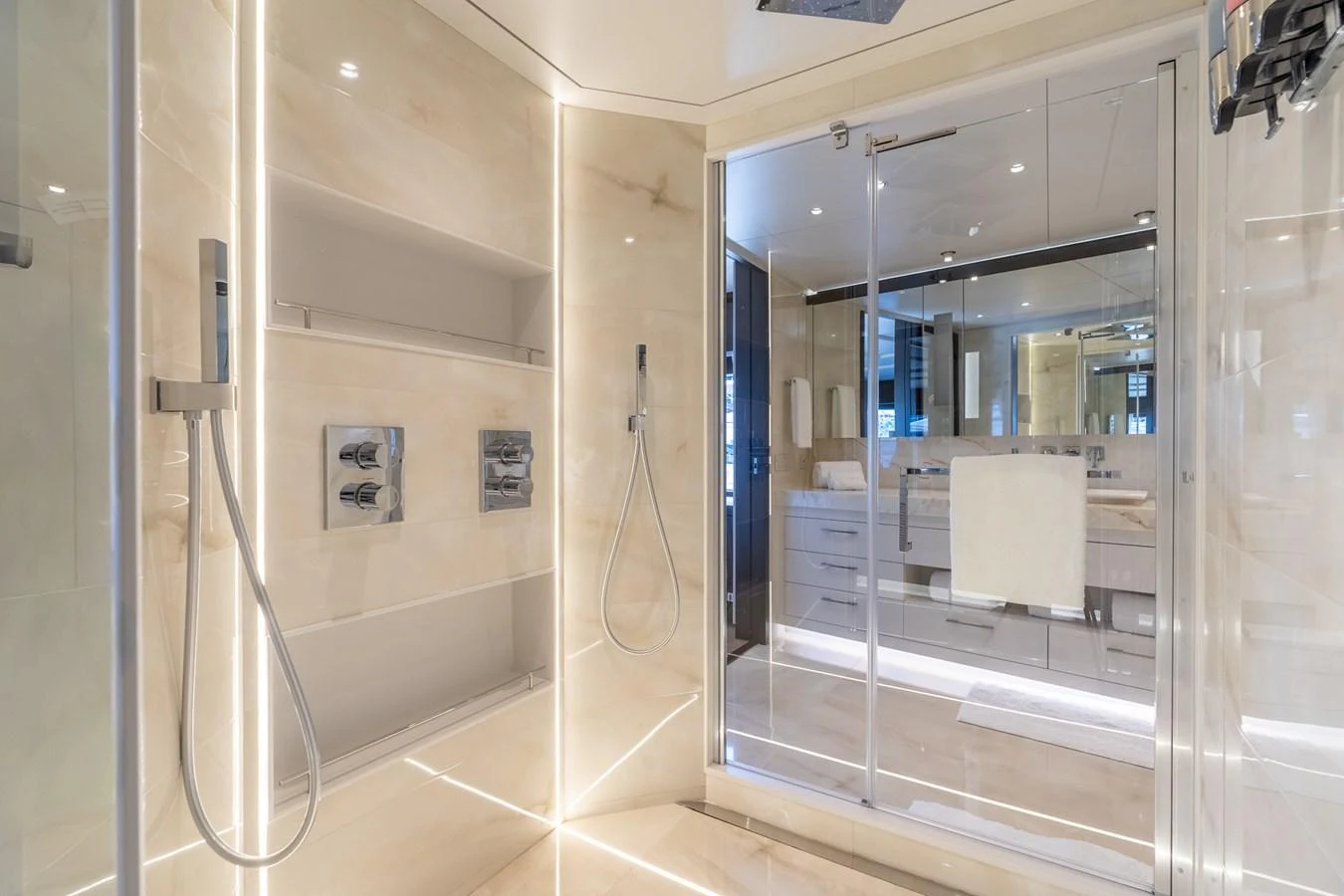 a bathroom with a glass shower aboard RESONANCE Yacht for Sale
