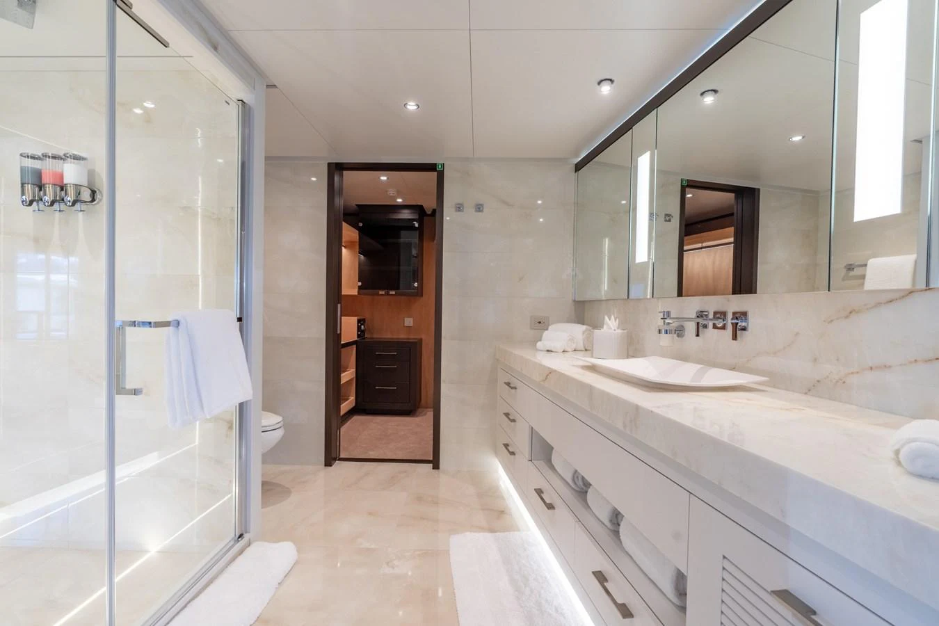 a bathroom with a large mirror aboard RESONANCE Yacht for Sale