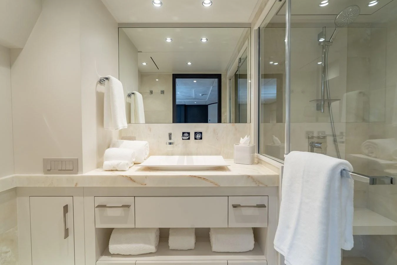 a bathroom with a large mirror aboard RESONANCE Yacht for Sale