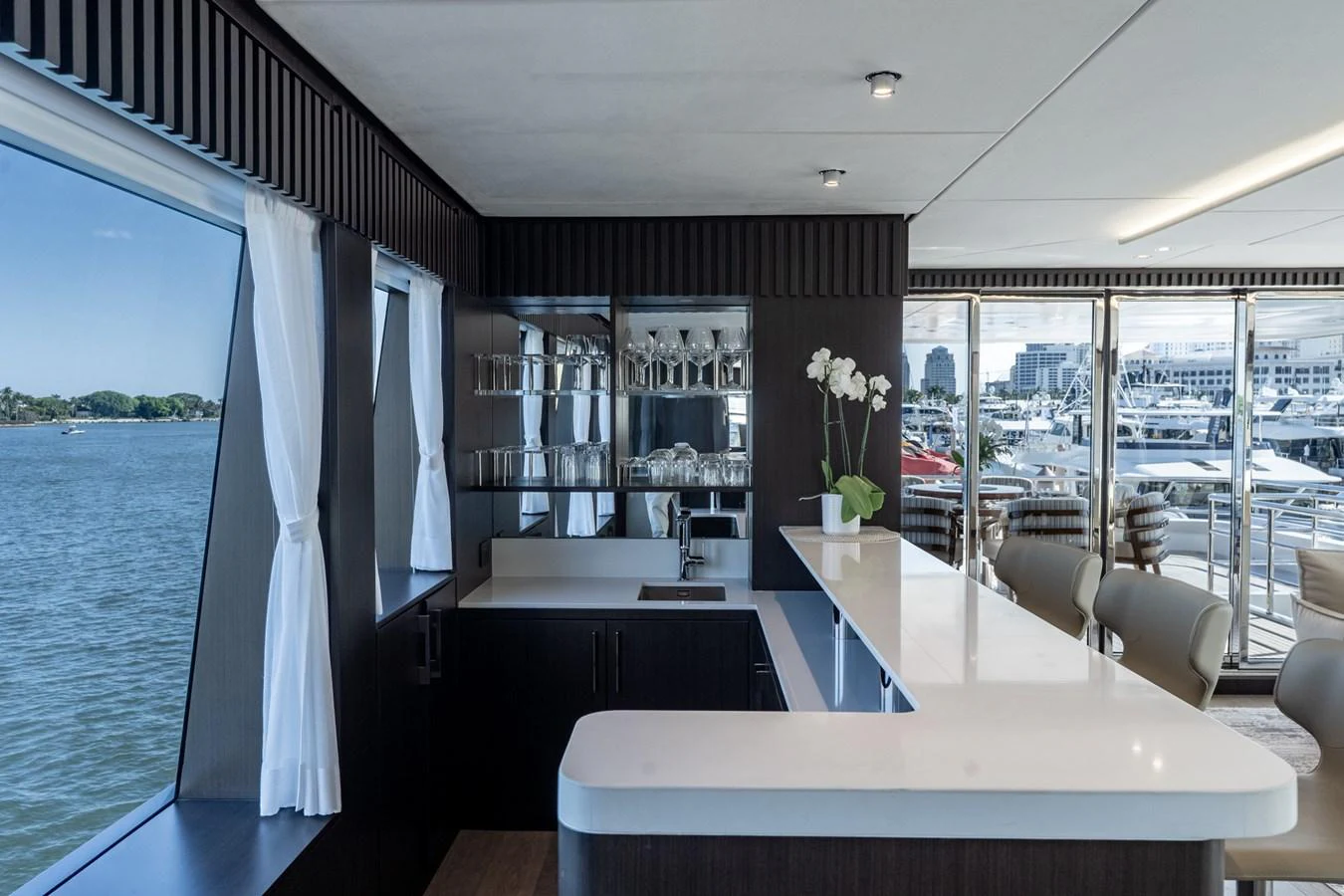 a room with a table and chairs aboard RESONANCE Yacht for Sale