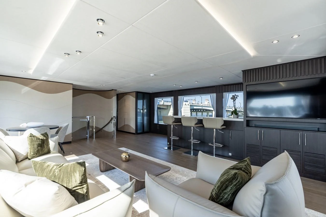 a living room with a large tv aboard RESONANCE Yacht for Sale