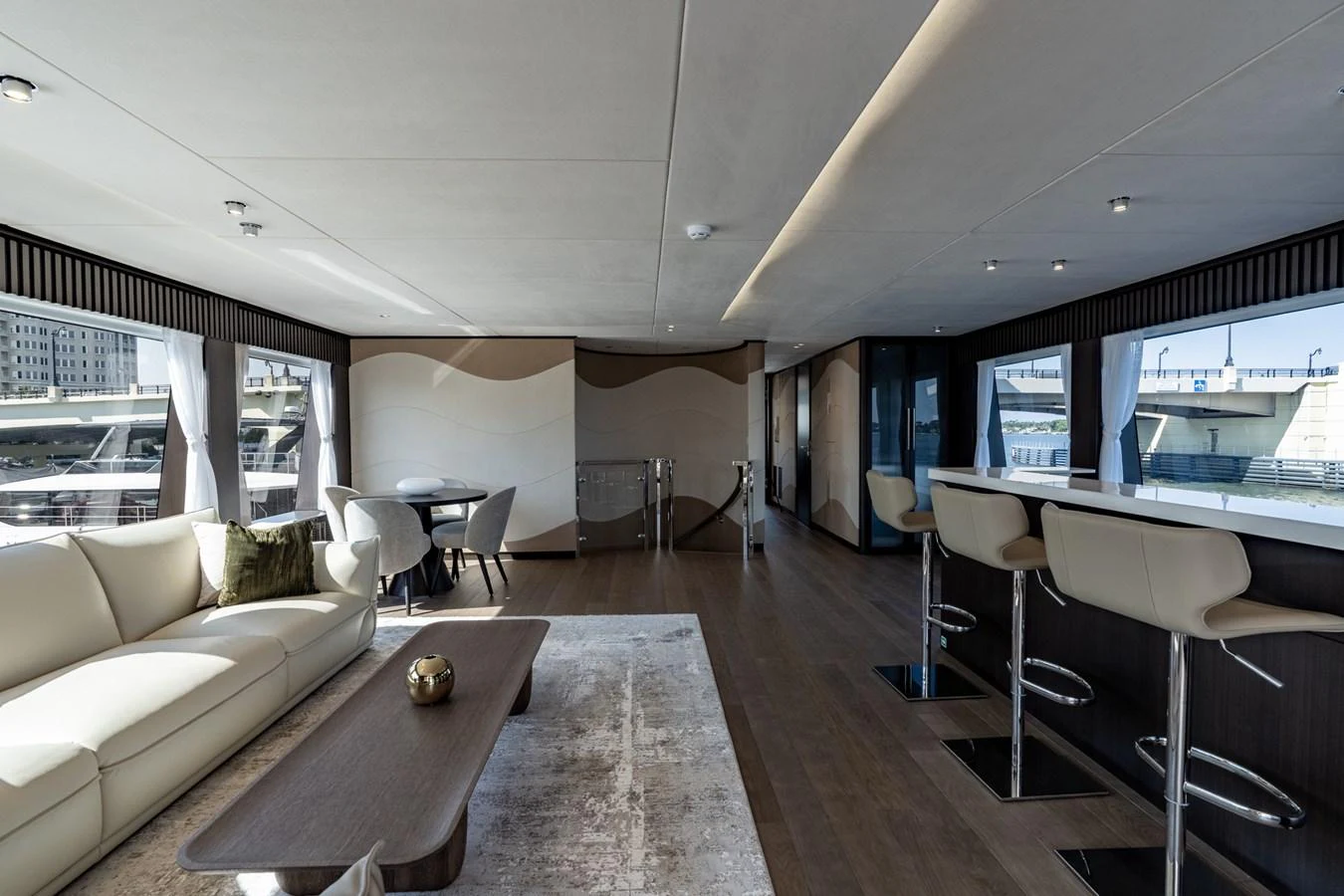a living room with a large window aboard RESONANCE Yacht for Sale