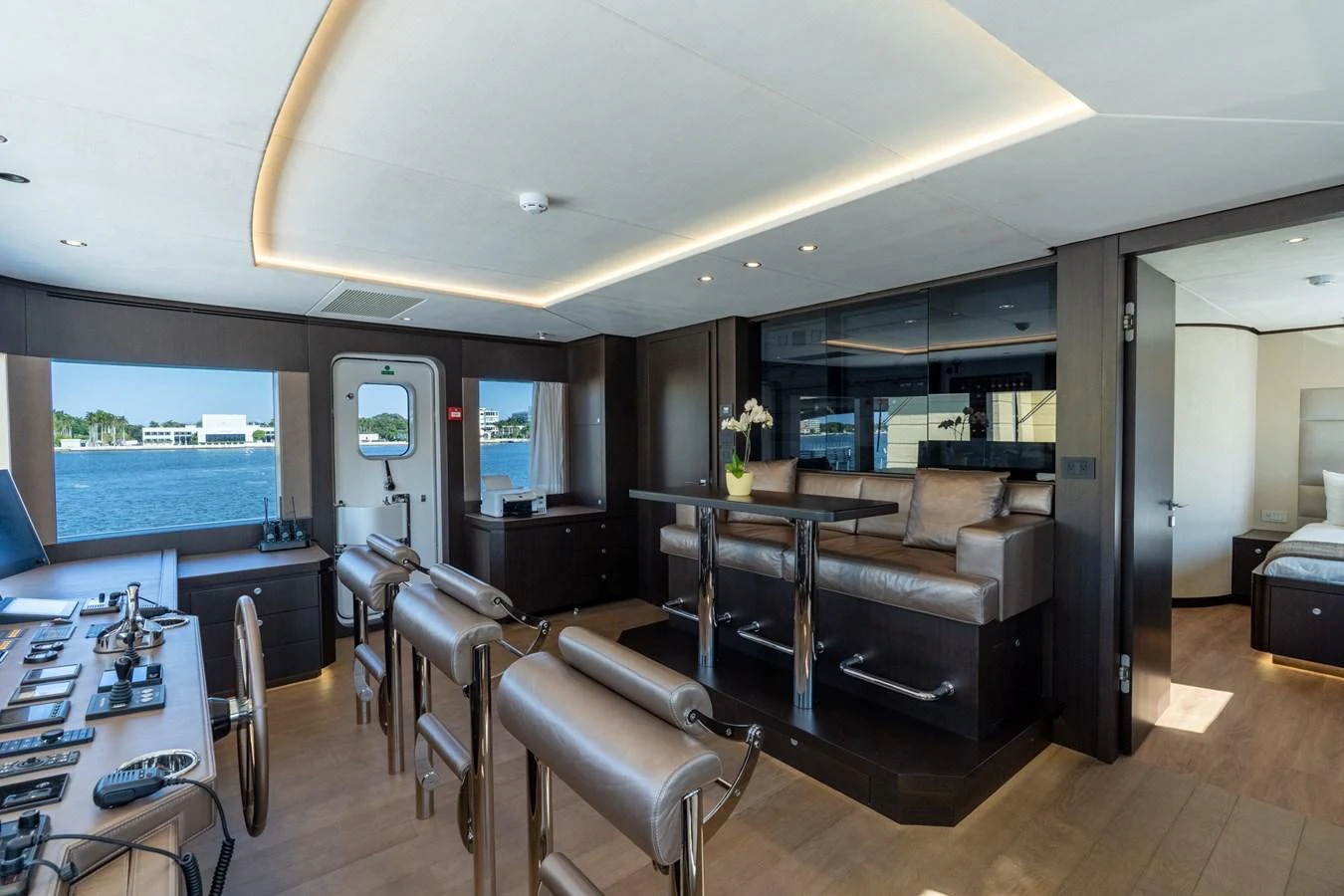 a living room with a leather couch aboard RESONANCE Yacht for Sale
