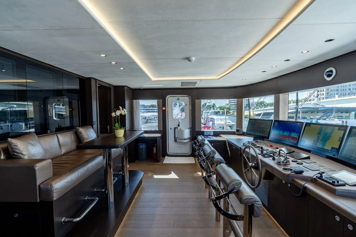 a room with a couch and a television aboard RESONANCE Yacht for Sale