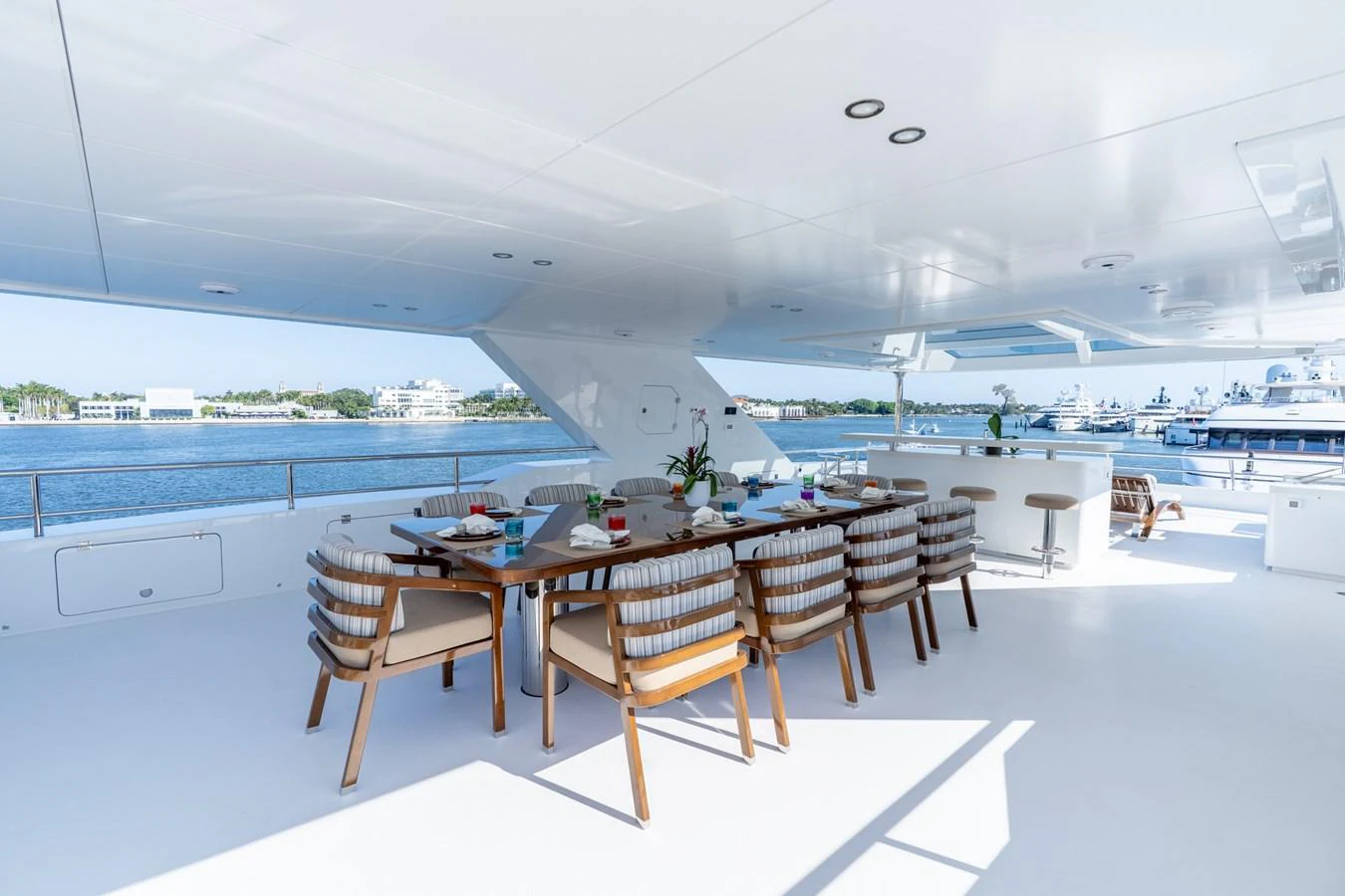 a room with tables and chairs aboard RESONANCE Yacht for Sale