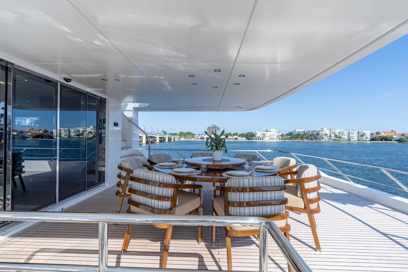 a room with a table and chairs on a deck aboard RESONANCE Yacht for Sale