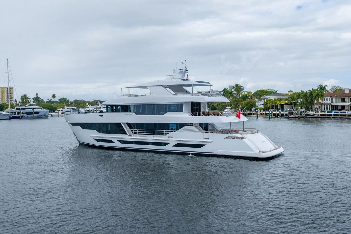 a large white boat in a harbor aboard RESONANCE Yacht for Sale
