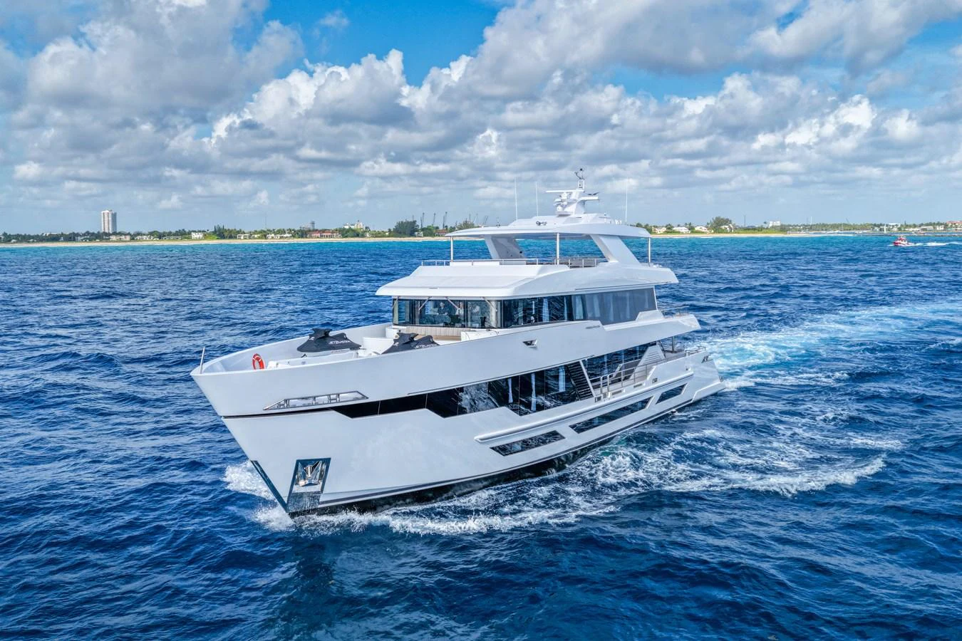 a white boat on the water aboard RESONANCE Yacht for Sale