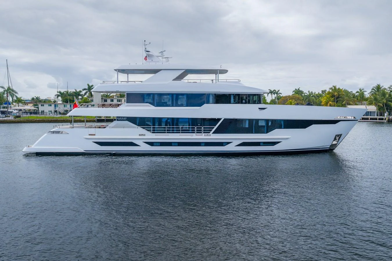 a large white boat on the water aboard RESONANCE Yacht for Sale