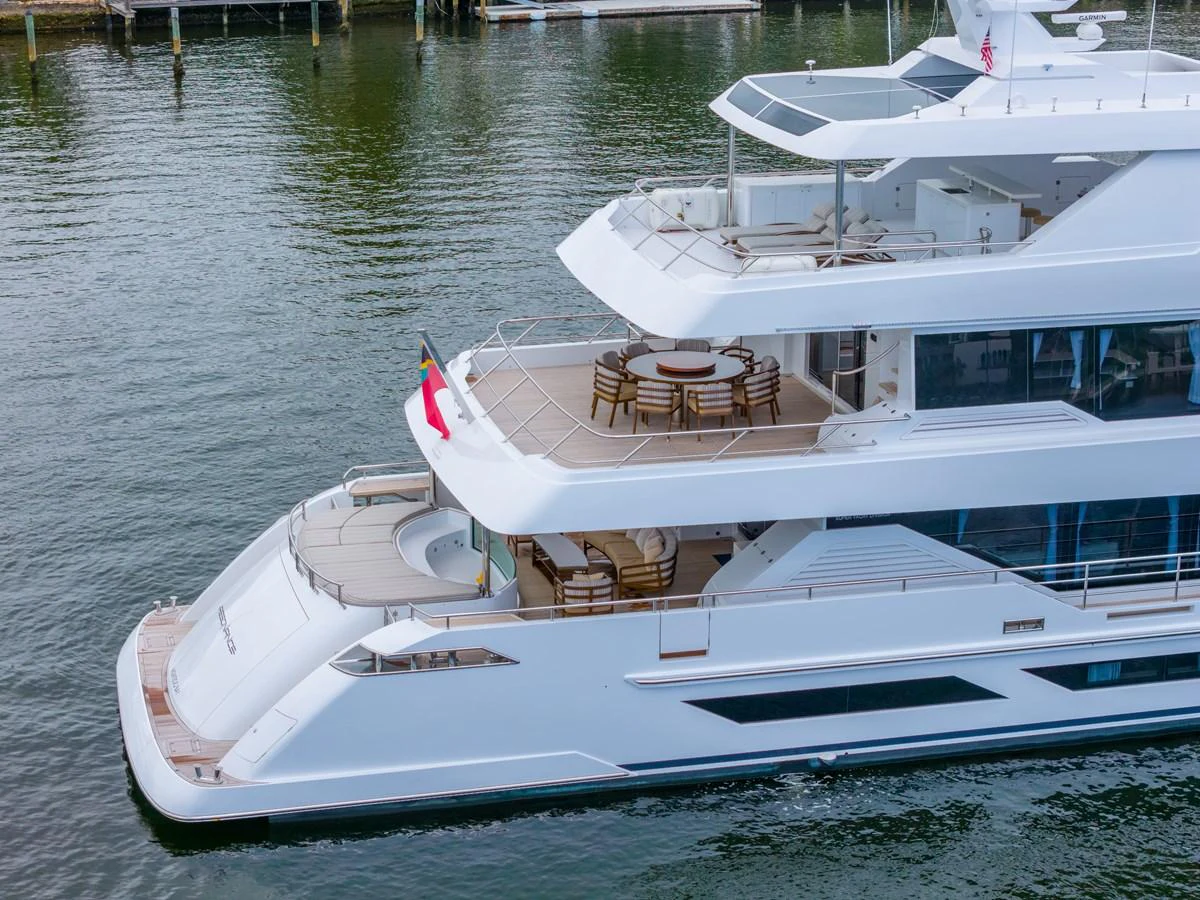 a white boat with a deck aboard RESONANCE Yacht for Sale