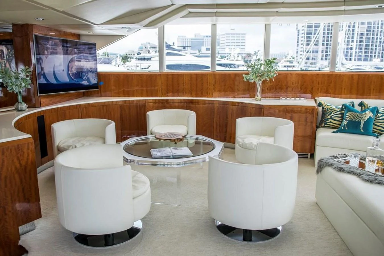 a room with a table chairs and a television aboard ALL STAR 1 Yacht for Sale
