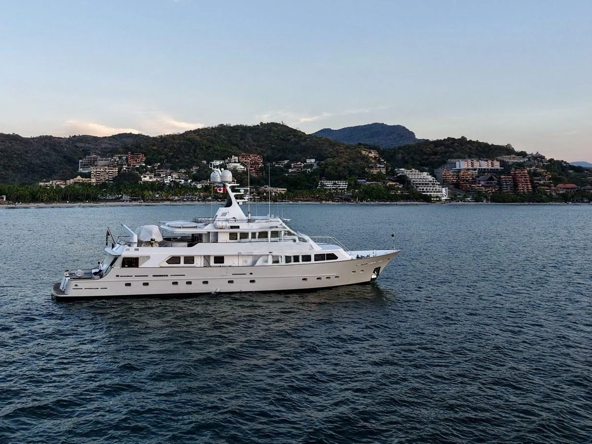 a white yacht in the water aboard MAVERICK Yacht for Sale