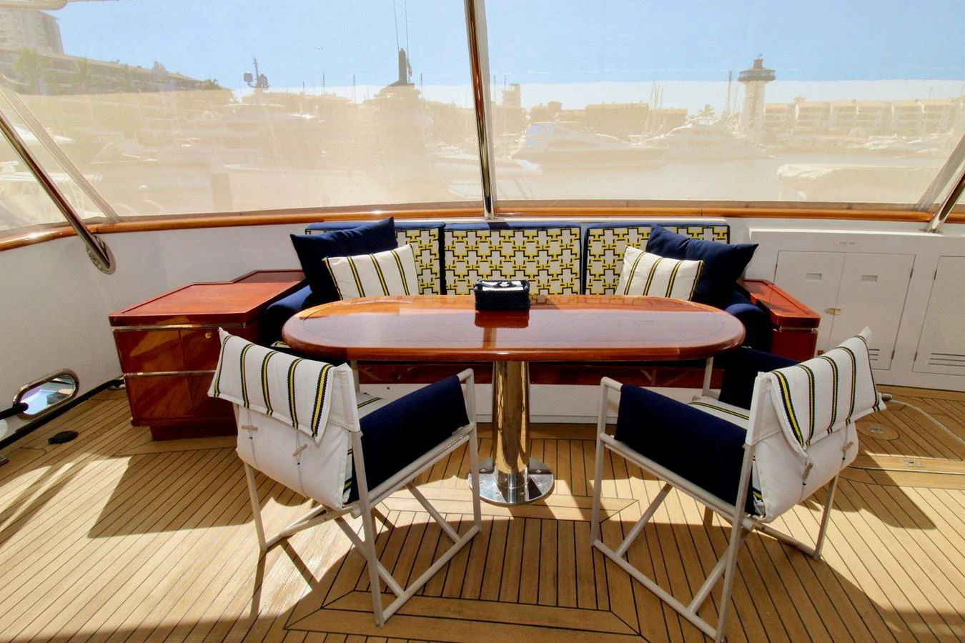 a table and chairs on a deck aboard MAVERICK Yacht for Sale