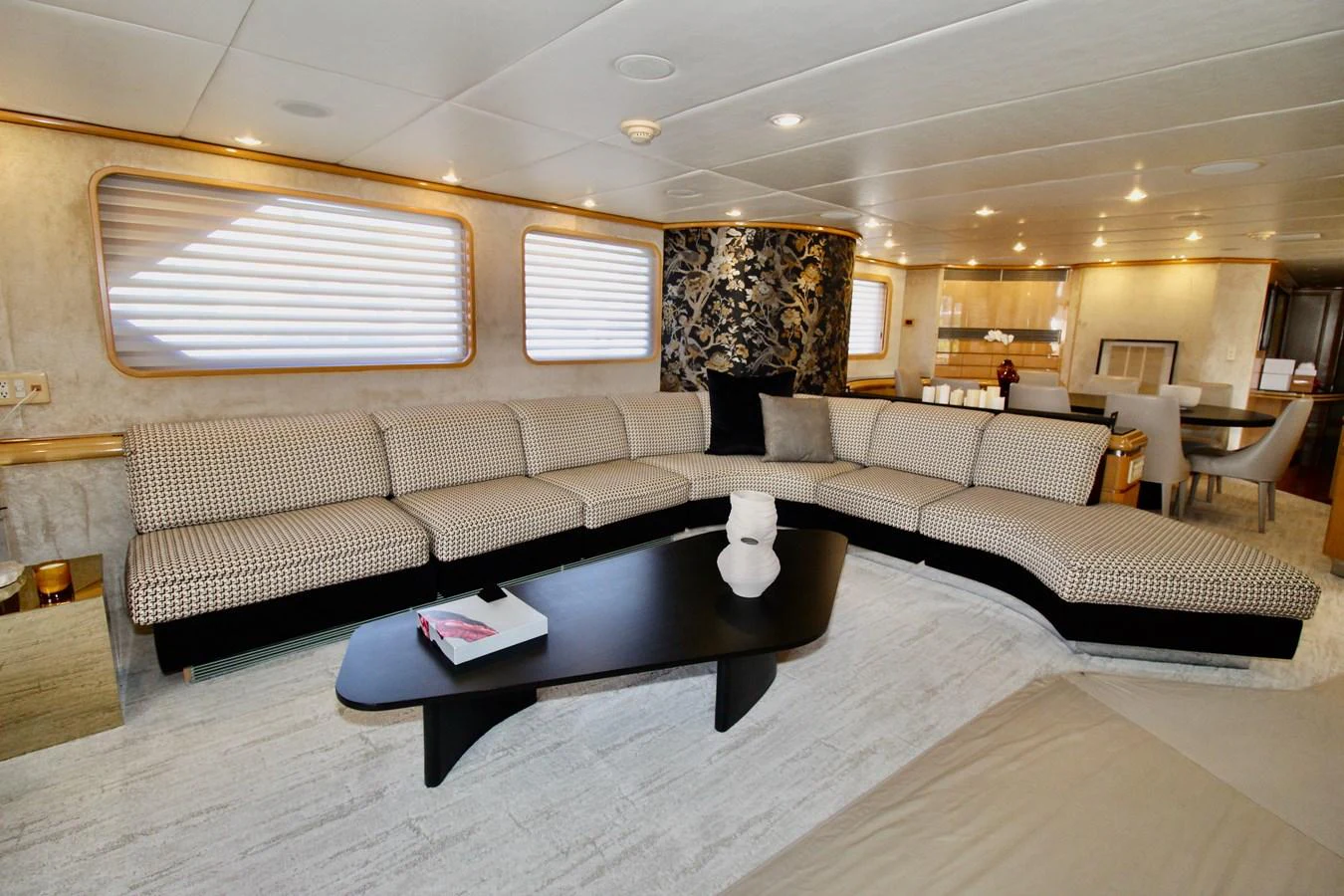 a living room with a couch and a coffee table aboard MAVERICK Yacht for Sale