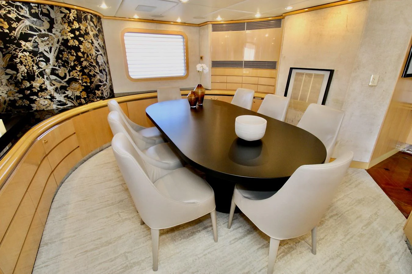 a room with a table and chairs aboard MAVERICK Yacht for Sale